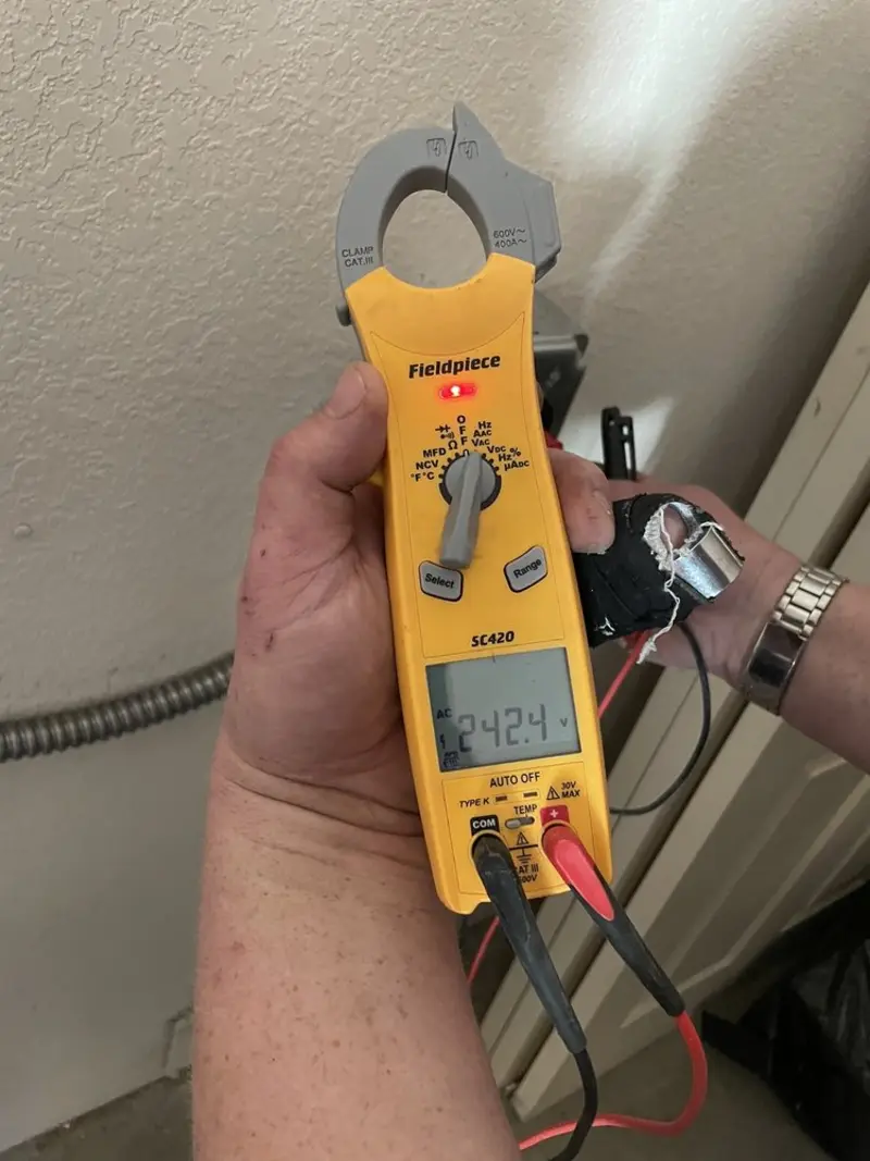 Voltage testing with clamp meter during Generator Installation in Dover